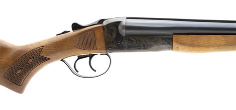 The two 28-inch blued steel barrels are adorned with a bead front sight. . Stevens 311d 20 gauge